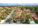 An aerial view of a desert community featuring well-maintained homes and mature trees in a serene, suburban setting at 5112 Onion Creek Ln, Las Vegas, NV 89113