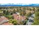 A picturesque neighborhood with mature trees, red tile roofs, and carefully manicured lawns, creates a serene living environment at 5112 Onion Creek Ln, Las Vegas, NV 89113