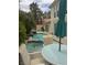 Inviting backyard with pool, lush landscaping, and comfortable patio seating, perfect for outdoor relaxation at 5112 Onion Creek Ln, Las Vegas, NV 89113