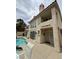 Stunning backyard with a pool and patio furniture, complemented by a beautiful two-story home at 5112 Onion Creek Ln, Las Vegas, NV 89113