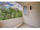 This balcony showcases the home's beautiful surroundings with lush greenery and a tranquil atmosphere at 5112 Onion Creek Ln, Las Vegas, NV 89113