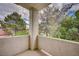 Outdoor balcony with stucco walls provides a private space to enjoy the fresh air and neighborhood views at 5112 Onion Creek Ln, Las Vegas, NV 89113