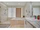 Contemporary bathroom featuring a glass-enclosed shower, soaking tub, and double sink vanity with granite countertops at 5112 Onion Creek Ln, Las Vegas, NV 89113