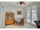 Cozy dining area with natural light, stylish cabinet, and door to the backyard at 5112 Onion Creek Ln, Las Vegas, NV 89113