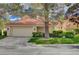 Charming single-Gathering home with mature trees, lush lawn, and a two-car garage at 5112 Onion Creek Ln, Las Vegas, NV 89113
