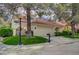 Charming single-Gathering home with mature trees, lush lawn, and a two-car garage at 5112 Onion Creek Ln, Las Vegas, NV 89113