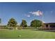 A well-manicured golf course with lush green fairways, mature trees, and a clear blue sky provides an idyllic setting at 5112 Onion Creek Ln, Las Vegas, NV 89113