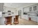 Spacious kitchen with island seating, granite countertops, and modern stainless steel appliances at 5112 Onion Creek Ln, Las Vegas, NV 89113