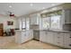 Bright kitchen with stainless steel appliances, granite counters, and dining area at 5112 Onion Creek Ln, Las Vegas, NV 89113