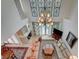 Bright living room with high ceilings, a fireplace, and views of the pool at 5112 Onion Creek Ln, Las Vegas, NV 89113