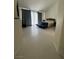Open main bedroom featuring tile floors, a comfortable day bed, and serene views of the backyard pool at 5112 Onion Creek Ln, Las Vegas, NV 89113