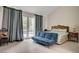 Spacious primary bedroom featuring French doors leading to a private pool and ensuite bath at 5112 Onion Creek Ln, Las Vegas, NV 89113