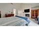 Bright primary bedroom with high ceilings and a fireplace and ensuite bathroom at 5112 Onion Creek Ln, Las Vegas, NV 89113