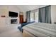 Bright primary bedroom with a fireplace and French doors leading to a private pool at 5112 Onion Creek Ln, Las Vegas, NV 89113