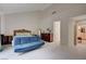 Bright primary bedroom with high ceilings, fireplace, and view to the bathroom and private outdoor pool at 5112 Onion Creek Ln, Las Vegas, NV 89113