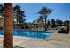 Sparkling community pool featuring shaded cabanas and mature landscaping for a resort-like experience at 5112 Onion Creek Ln, Las Vegas, NV 89113