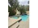 Relaxing pool and spa with tiled accents, surrounded by mature trees and privacy walls at 5112 Onion Creek Ln, Las Vegas, NV 89113