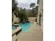 Refreshing pool and spa nestled in a private backyard with mature trees and lush landscaping at 5112 Onion Creek Ln, Las Vegas, NV 89113