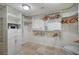 A spacious walk-in closet featuring custom shelving and ample storage space for organization at 5112 Onion Creek Ln, Las Vegas, NV 89113