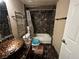 Bathroom with marble-style wall covering, single sink, and shower over tub at 5188 River Glen Dr # 453, Las Vegas, NV 89103