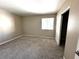 Bedroom featuring neutral walls, plush carpet, and a window for natural light at 5188 River Glen Dr # 453, Las Vegas, NV 89103