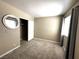 Bedroom featuring neutral walls, carpet, closet, and window with curtains at 5188 River Glen Dr # 453, Las Vegas, NV 89103