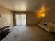 Living room with a sliding glass door and comfortable seating arrangement at 5188 River Glen Dr # 453, Las Vegas, NV 89103