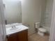 Well-lit bathroom featuring a single sink vanity, toilet, and a shower-tub combination at 523 Cabis Bay St, Las Vegas, NV 89178