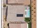 Aerial view of a house featuring a private pool, solar panels, and a well-maintained backyard in a desert landscape at 5321 Brayden Ct, Las Vegas, NV 89131