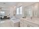 Bright bathroom with a soaking tub, double vanities, and access to the main bedroom at 5321 Brayden Ct, Las Vegas, NV 89131