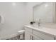 Clean powder room featuring a modern vanity, framed mirror, and gray tile flooring at 5321 Brayden Ct, Las Vegas, NV 89131