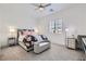 Charming bedroom with stylish bedding, a bench seat, and mirrored nightstands at 5321 Brayden Ct, Las Vegas, NV 89131