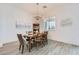 Charming dining room with modern light fixture, neutral paint, and sleek flooring at 5321 Brayden Ct, Las Vegas, NV 89131