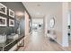 Inviting hallway with decorative wall art and a view into the home's living spaces at 5321 Brayden Ct, Las Vegas, NV 89131
