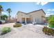 Expansive backyard featuring a patio, desert landscaping, and a small playhouse at 54 Blue Fountain Ct, Henderson, NV 89012