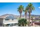 Home exterior with solar panels, palm trees and mountain views in the backyard at 54 Blue Fountain Ct, Henderson, NV 89012