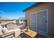 A cozy balcony is furnished with chairs and a small table at 54 Blue Fountain Ct, Henderson, NV 89012