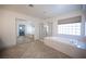 Bathroom with walk-in closet, soaking tub, walk-in shower, tile floors and natural light at 54 Blue Fountain Ct, Henderson, NV 89012