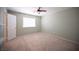 This spacious bedroom has a ceiling fan, neutral carpet and bright window with blinds at 54 Blue Fountain Ct, Henderson, NV 89012