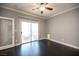 Bedroom with dark wood floor and sliding glass door out to patio at 54 Blue Fountain Ct, Henderson, NV 89012