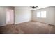 Comfortable bedroom with carpet flooring and a doorway leading to another room at 54 Blue Fountain Ct, Henderson, NV 89012