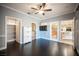 Spacious bedroom features dark wood floors, closets, and a ceiling fan at 54 Blue Fountain Ct, Henderson, NV 89012