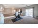 Bonus room with neutral walls and carpet, featuring exercise equipment and access to a balcony at 54 Blue Fountain Ct, Henderson, NV 89012