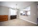 Open dining room featuring tile floors, neutral walls, and a view into the adjacent living room at 54 Blue Fountain Ct, Henderson, NV 89012