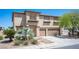 Beautiful two-story home with lush landscaping, two-car garage, and a well-maintained exterior at 54 Blue Fountain Ct, Henderson, NV 89012