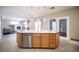 Kitchen island with sink and dishwasher with a view of the living area at 54 Blue Fountain Ct, Henderson, NV 89012