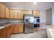 Kitchen with stainless steel refrigerator and double ovens, and light colored wood cabinets at 54 Blue Fountain Ct, Henderson, NV 89012