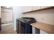 Convenient laundry room with modern washer and dryer, cabinetry, and a built-in bench at 54 Blue Fountain Ct, Henderson, NV 89012