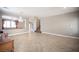 Bright living room with tile flooring, stairs, and neutral paint for versatile styling at 54 Blue Fountain Ct, Henderson, NV 89012