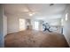 Large living room with neutral walls, carpet, and a view to a bonus room and bathroom at 54 Blue Fountain Ct, Henderson, NV 89012